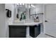 Bathroom featuring dual mirrors, modern fixtures, and ample counter space with storage at 8150 Beaverbrook Way, Las Vegas, NV 89123