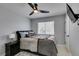 Bedroom with ceiling fan, window with blinds, and mounted television at 8150 Beaverbrook Way, Las Vegas, NV 89123