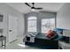Bedroom with vaulted ceiling, windows with blinds and mounted television at 8150 Beaverbrook Way, Las Vegas, NV 89123