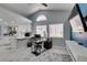 Home office with lots of natural light and modern desk setup, with a view into the kitchen area at 8150 Beaverbrook Way, Las Vegas, NV 89123