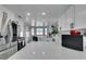 Modern white kitchen with stainless steel appliances and sleek countertops at 8150 Beaverbrook Way, Las Vegas, NV 89123