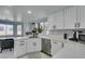Bright kitchen boasts white cabinets, stainless appliances, and abundant countertop space at 8150 Beaverbrook Way, Las Vegas, NV 89123
