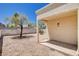 Backyard features a covered patio and a gravel area with a tree at 8233 Willeta Ave, Las Vegas, NV 89145