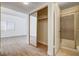 Bathroom featuring a closet, shower and access to the bedroom and natural light at 8233 Willeta Ave, Las Vegas, NV 89145
