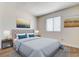 Well-lit bedroom with a comfortable bed, stylish decor, and ample natural light at 8233 Willeta Ave, Las Vegas, NV 89145