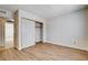 Empty bedroom featuring vinyl flooring, closet, and lots of natural light at 8233 Willeta Ave, Las Vegas, NV 89145