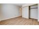 Bedroom showcasing vinyl flooring, closet, and a neutral color palette at 8233 Willeta Ave, Las Vegas, NV 89145