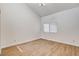 This spacious bedroom features wood floors, bright natural light, and modern fixtures at 8233 Willeta Ave, Las Vegas, NV 89145