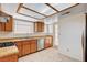 Traditional kitchen featuring stainless steel appliances, tile floors, light wood cabinets and countertops at 8233 Willeta Ave, Las Vegas, NV 89145