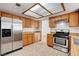 Charming kitchen with stainless steel appliances, tile flooring, and ample cabinet storage at 8233 Willeta Ave, Las Vegas, NV 89145