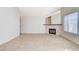 Open-concept living room featuring tile flooring, neutral paint, and a fireplace at 8233 Willeta Ave, Las Vegas, NV 89145