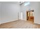 Spacious main bedroom with light wood flooring, high ceiling, and access to the ensuite bathroom at 8233 Willeta Ave, Las Vegas, NV 89145