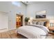 Bright main bedroom featuring a high ceiling, stylish decor, and an ensuite bathroom at 8233 Willeta Ave, Las Vegas, NV 89145
