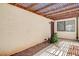 Enclosed patio featuring a wood pergola, desert landscaping, and shade at 8233 Willeta Ave, Las Vegas, NV 89145