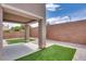 The backyard has a covered patio, a small grass area and low-maintenance gravel surrounding the perimeter at 8745 Dodds Canyon St, Las Vegas, NV 89131