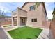 The back of the house has a covered patio with access to a small balcony overlooking the backyard at 8745 Dodds Canyon St, Las Vegas, NV 89131