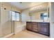 Bathroom with glass shower, soaking tub, and double sink vanity at 8745 Dodds Canyon St, Las Vegas, NV 89131