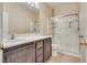 Neutral bathroom featuring a vanity and glass shower door at 8745 Dodds Canyon St, Las Vegas, NV 89131