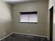 Neutral bedroom featuring carpet flooring and a window with horizontal blinds at 8745 Dodds Canyon St, Las Vegas, NV 89131