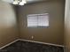 This bedroom has carpeted floors, overhead lighting, and a window for natural light at 8745 Dodds Canyon St, Las Vegas, NV 89131