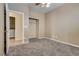 This carpeted bedroom has access to the laundry room at 8745 Dodds Canyon St, Las Vegas, NV 89131