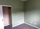 Bedroom featuring carpet flooring, an open closet, and light green walls at 8745 Dodds Canyon St, Las Vegas, NV 89131