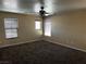 Spacious bedroom with ceiling fan and three windows providing natural light at 8745 Dodds Canyon St, Las Vegas, NV 89131