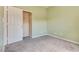 This carpeted bedroom features an open closet and neutral walls at 8745 Dodds Canyon St, Las Vegas, NV 89131