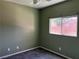 Bedroom featuring carpet flooring, a ceiling fan, and a window at 8745 Dodds Canyon St, Las Vegas, NV 89131