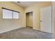 This carpeted bedroom features a closet and window with blinds at 8745 Dodds Canyon St, Las Vegas, NV 89131