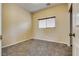 Carpeted bedroom with window and neutral walls at 8745 Dodds Canyon St, Las Vegas, NV 89131