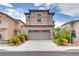Charming two-story home with a two-car garage, desert landscaping, and inviting curb appeal at 8745 Dodds Canyon St, Las Vegas, NV 89131