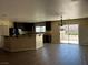 Open living room and kitchen area with sliding door access to the outside at 8745 Dodds Canyon St, Las Vegas, NV 89131