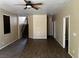 Open-concept living room with hard surface floors and staircase access at 8745 Dodds Canyon St, Las Vegas, NV 89131