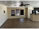 Open-concept living room with wood floors and access to kitchen at 8745 Dodds Canyon St, Las Vegas, NV 89131