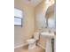 Cozy powder room with a pedestal sink and neutral decor at 8745 Dodds Canyon St, Las Vegas, NV 89131
