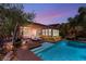 Stunning backyard with pool, landscaping, and outdoor seating area at 900 Cantura Mills Rd, Henderson, NV 89052