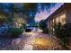 Lush backyard with stone pathway leading to a private pool at 900 Cantura Mills Rd, Henderson, NV 89052