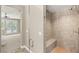 Walk in shower with tile and bench inside the main bathroom at 900 Cantura Mills Rd, Henderson, NV 89052