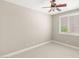 Neutral bedroom featuring plush carpet, a ceiling fan, and a window with shutter blinds at 900 Cantura Mills Rd, Henderson, NV 89052