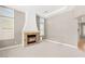 Spacious living room with a decorative fireplace and plantation shutters at 900 Cantura Mills Rd, Henderson, NV 89052