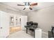 Comfortable office space with neutral walls, plush carpeting, and open doorway at 900 Cantura Mills Rd, Henderson, NV 89052