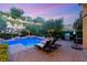 Gorgeous pool with spa, rock wall, and BBQ at 900 Cantura Mills Rd, Henderson, NV 89052