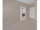 Neutral colored bedroom featuring carpet flooring, light fixtures and an opening to the bathroom at 9017 Cotton Rose Way, Las Vegas, NV 89134