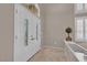 Bright foyer featuring double doors with decorative glass and tiled flooring at 9017 Cotton Rose Way, Las Vegas, NV 89134