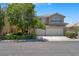 Charming two-story home with lush landscaping and a spacious three-car garage at 9017 Cotton Rose Way, Las Vegas, NV 89134