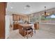 Well-lit kitchen featuring a granite island and stainless steel appliances at 9017 Cotton Rose Way, Las Vegas, NV 89134
