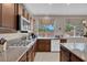 Granite countertops and updated appliances featured in this kitchen at 9017 Cotton Rose Way, Las Vegas, NV 89134