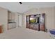 Living room featuring vaulted ceiling, built-in shelving and cabinets at 9017 Cotton Rose Way, Las Vegas, NV 89134