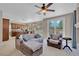 Inviting living room with a ceiling fan that opens up to a backyard pool at 9017 Cotton Rose Way, Las Vegas, NV 89134